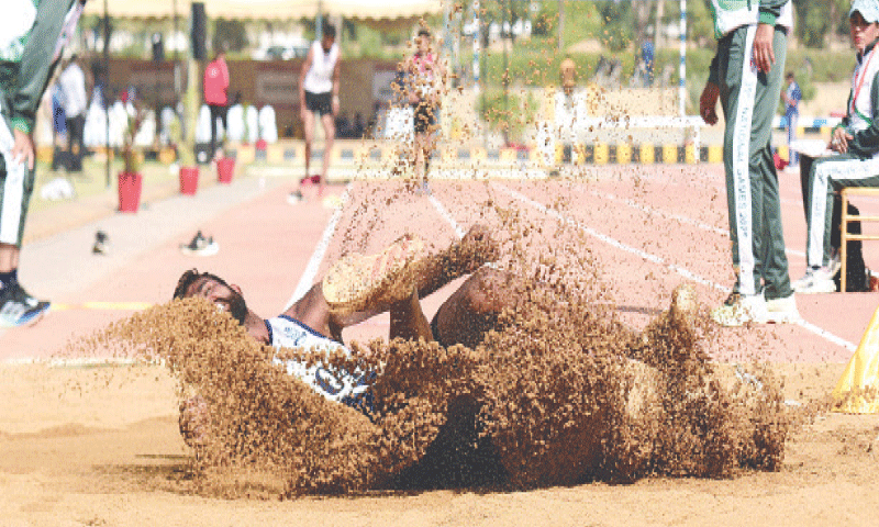 KARACHI: Pakistan Navy&rsquo;s Ansar Abbas competes to win the men&rsquo;s long jump during the National Games at NPTSC Karsaz on Monday.&mdash;Tahir Jamal/White Star