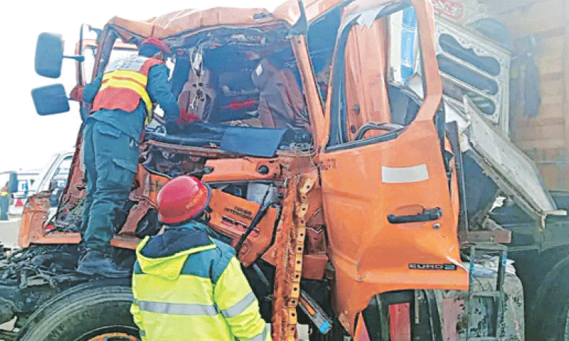 RescueRS inspect a truck after an accident on the Multan-Sukkur Motorway.&mdash;Courtesy Rescue 1122