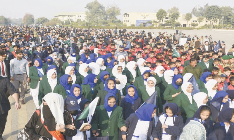 Students participate in an awareness walk against corruption at Pakistan Sports Complex in Islamabad on Wednesday. &mdash; Photo by Tanveer Shahzad