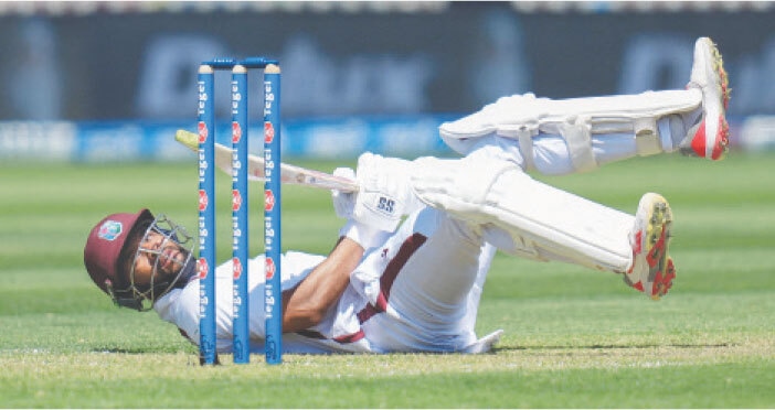 WELLINGTON: West Indies batter Shai Hope falls over after ducking a bouncer during the second Test against New Zealand at the Basin Reserve on Wednesday.—AFP