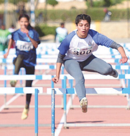 KARACHI: Wapda&rsquo;s Ghazala Ramzan competes to win the women&rsquo;s 100m hurdles during the National Games at the NPT&SC on Wednesday.&mdash;Tahir Jamal/White Star