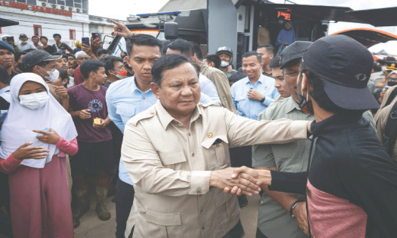 INDONESIAN President Prabowo Subianto meets people displaced by the floods last week at a shelter in Aceh Tamiang.—AFP INDONESIAN President Prabowo Subianto meets people displaced by the floods last week at a shelter in Aceh Tamiang.—AFP