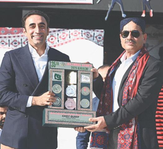 KARACHI: Pakistan Peoples Party chairman Bilawal Bhutto-Zardari (L) presents a souvenir to Chief of the Defence Forces Field Marshal Asim Munir during the closing ceremony of the National Games at the National Bank Stadium on Saturday.&mdash;Courtesy Sindh Information Department