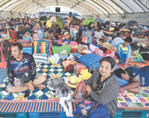  Displaced residents rest at an evacuation centre in the Thai border province of Buriram.—AFP 