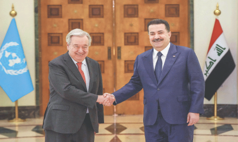Iraq&rsquo;s Prime Minister Mohammed Shia al Sudani shakes hands with United Nations Secretary General Antonio Guterres during a meeting in Baghdad.&mdash;AFP