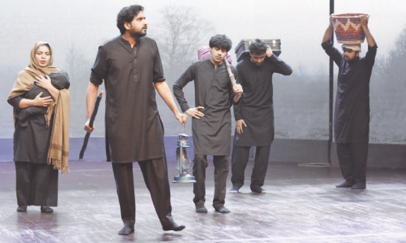 Artists perform in a play held in connection with International Migrants Day at the PNCA in Islamabad on Monday. &mdash; Photo by Tanveer Shahzad