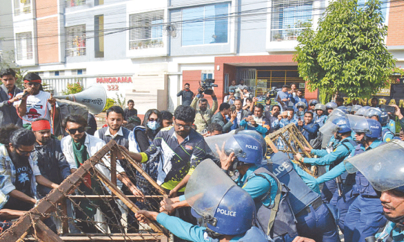 POLICE try to stop demonstrators as they march towards the Indian assistant high commissioner’s office in Rajshahi, Bangladesh.—AFP POLICE try to stop demonstrators as they march towards the Indian assistant high commissioner’s office in Rajshahi, Bangladesh.—AFP