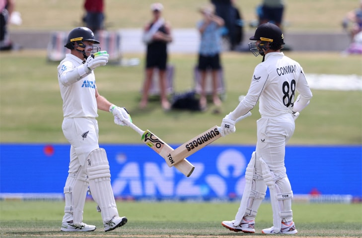 NEW ZEALAND opener Devon Conway (R) celebrates his century with Tom Latham during the third Test against
West Indies at the Bay Oval on Thursday.—AFP