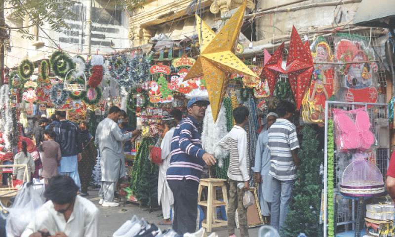 A big golden Christmas star hanging at a shop in Bohri Bazaar, grabs a passer-by&rsquo;s attention. 
&mdash; Fahim Siddiqi / White Star