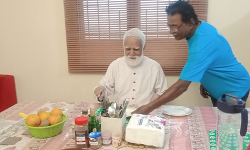 The finicky eater, Cardinal Joseph Coutts, being coaxed into having something by Mr William, his
majordomo | Photos by the writer