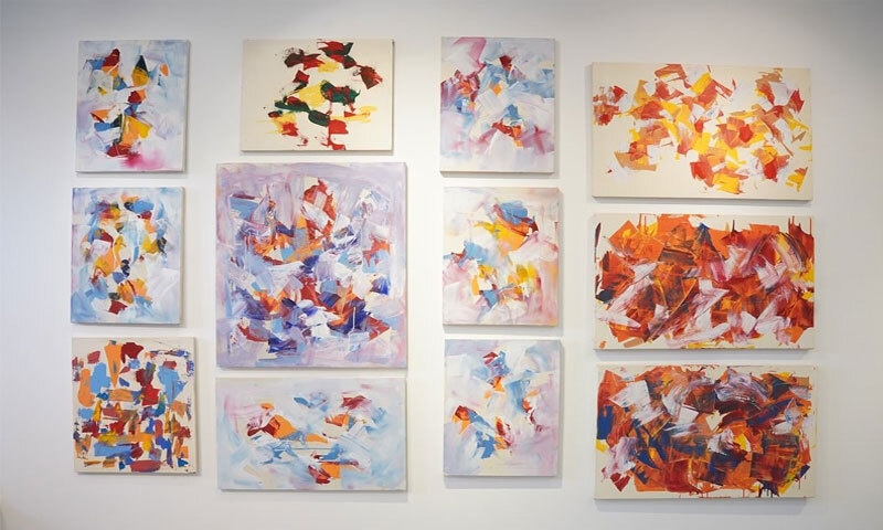 A collection of some of Mashkoor Raza's paintings on display at the exhibition