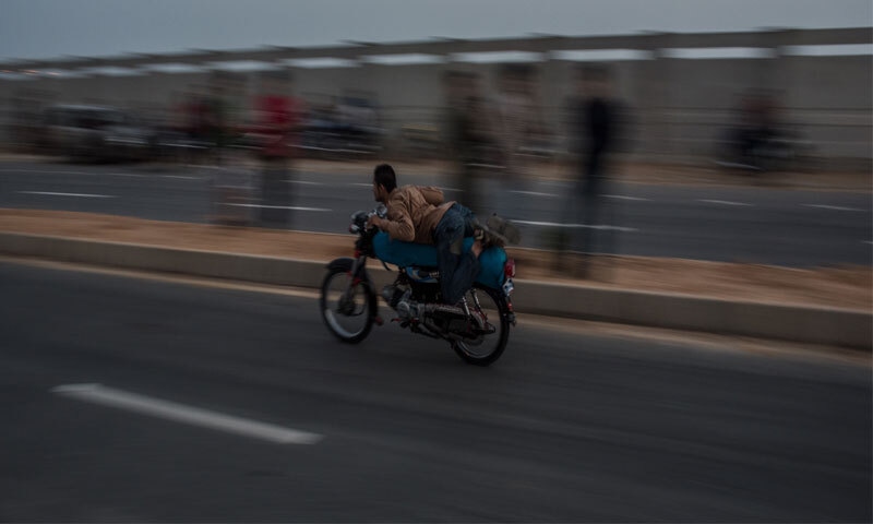 Motorcyclists known as shapatars hold an aerodynamic pose during races and don't use any protective gear | Mohammad Ali Addarsh/White Star