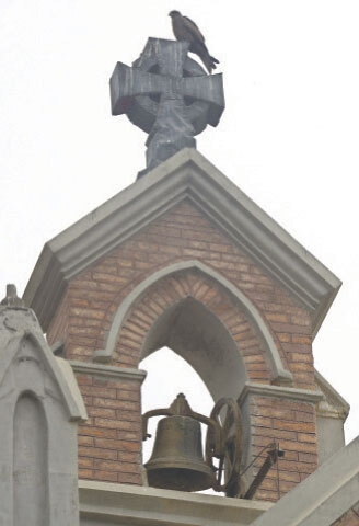 A brass bell installed on the tower.