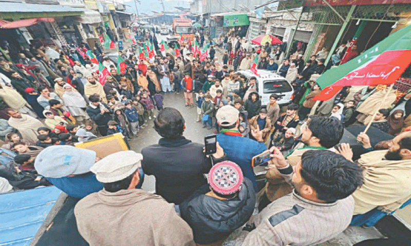 PTI supporters stage a protest in Bajaur on Sunday. &mdash; Dawn
