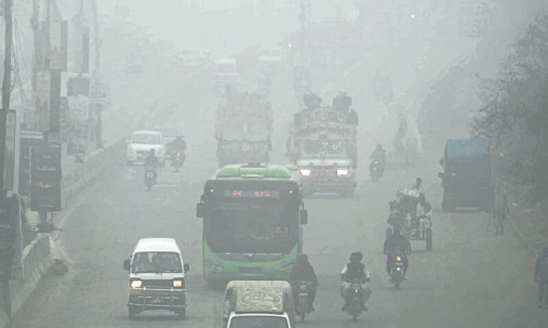 The city road is barely visible due to hazy conditions. &mdash;INP