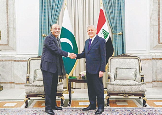 President Asif Ali Zardari shakes hands with his Iraqi counterpart, Dr Abdul Latif Jamal Rashid, at Baghdad Palace.&mdash;APP