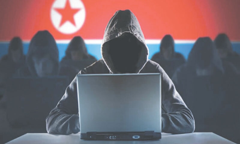 Illustration shows hackers against a North Korean flag backdrop.&mdash;Courtesy  The Korea Herald