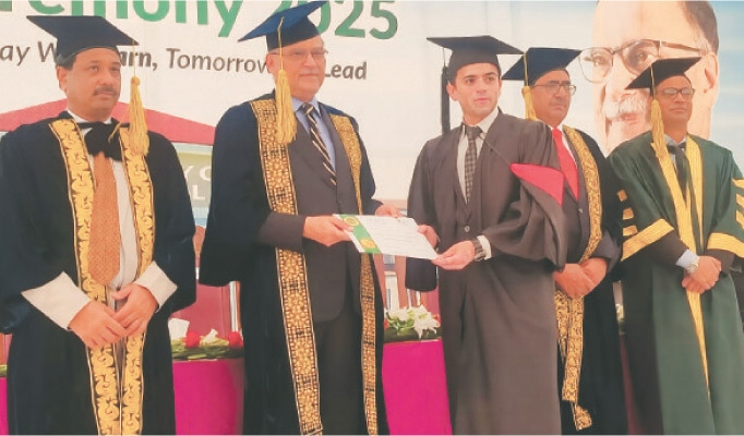 NAROWAL: Federal Minister for Planning, Development and Special Initiatives Ahsan Iqbal awards degree to a graduate at the convocation of the University of Narowal. &mdash; Dawn