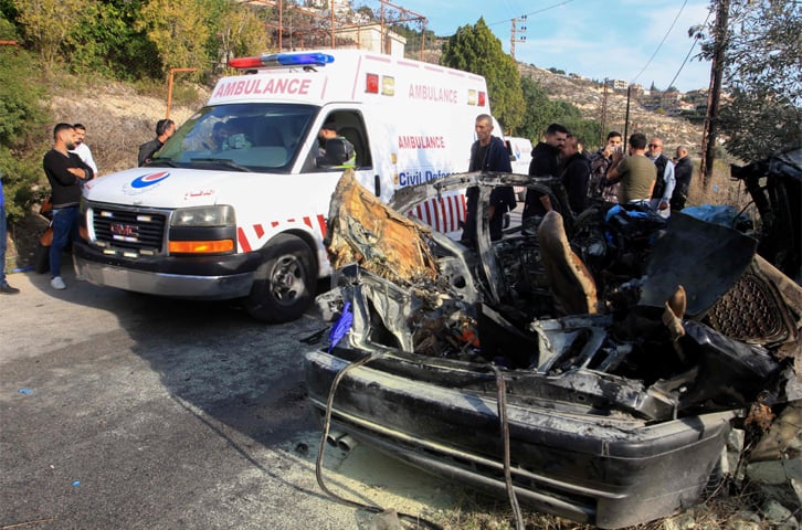 First responders at the site of the Israeli strike that targeted a car near the southern Lebanese village of Mazraat al Qnaitra.—AFP
