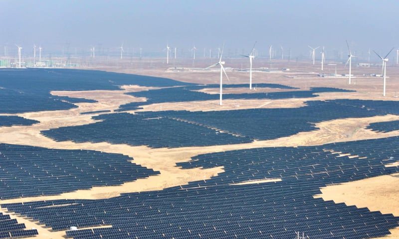 A view of solar panels and wind turbines at a renewable energy farm in Lingwu, in China’s northern Ningxia region.—AFP A view of solar panels and wind turbines at a renewable energy farm in Lingwu, in China’s northern Ningxia region.—AFP