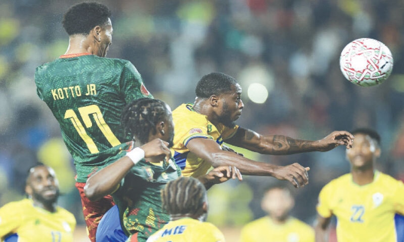 AGADIR: Cameroon&rsquo;s Samuel Kotto (L) vies for the ball with Gabon&rsquo;s Alex Moucketou-Moussounda during the Africa Cup of Nations match at the Adrar Stadium.&mdash;AFP