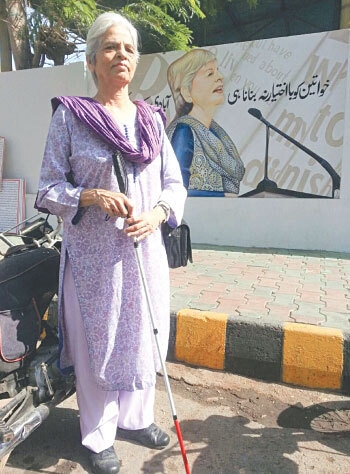 Zubeida Mustafa, &ldquo;one of the wisest people on earth&rdquo; outside the Karachi Press Club with her own picture on one of its walls | Photo by Rumana Husain