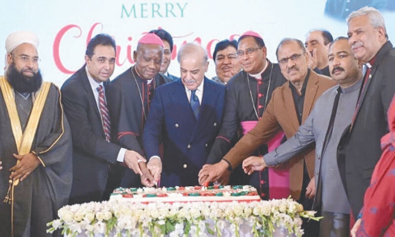 PM SHEHBAZ Sharif cuts a cake along with Christian leaders and other government officials, at a Christmas ceremony held at the PM’s House.—White Star PM SHEHBAZ Sharif cuts a cake along with Christian leaders and other government officials, at a Christmas ceremony held at the PM’s House.—White Star
