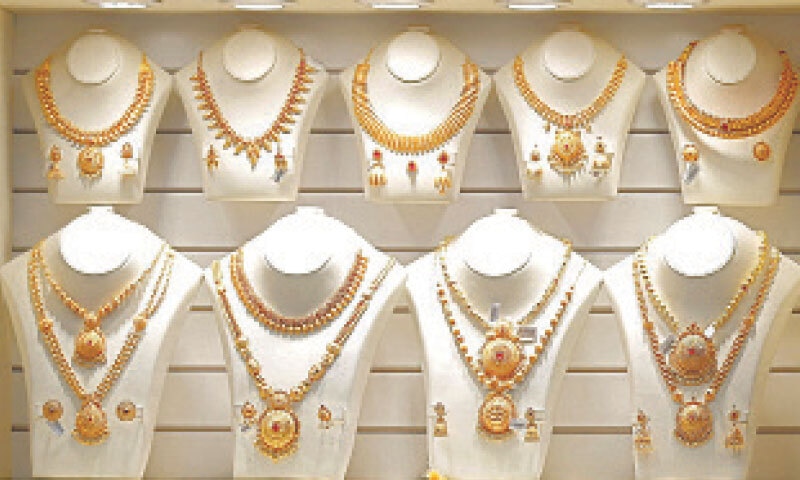 Necklaces are on display in Mumbai. Precious metals are headed for weekly gains, with platinum recording its strongest rise ever.—Reuters/file Necklaces are on display in Mumbai. Precious metals are headed for weekly gains, with platinum recording its strongest rise ever.—Reuters/file