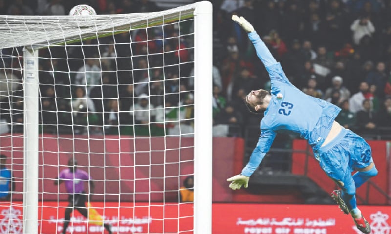 RABAT: Algeria goalkeeper Luca Zidane makes a save during the Africa Cup of Nations match against Burkino Faso at Moulay Hassan Stadium.—AFP RABAT: Algeria goalkeeper Luca Zidane makes a save during the Africa Cup of Nations match against Burkino Faso at Moulay Hassan Stadium.—AFP
