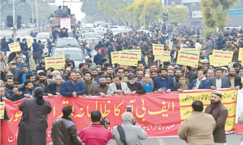 Traders stage a rally at Aabpara Chowk in Islamabad on Tuesday against installation of Point of Sale devices at various shops. &mdash; Photo by Mohammad Asim