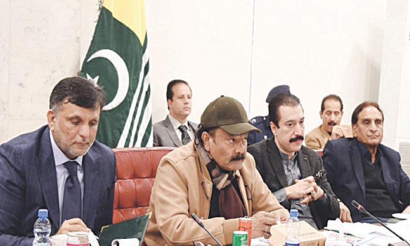 ISLAMABAD: AJK PM Faisal Mumtaz Rath&shy;ore (2nd from right) and Speaker Chaudhry Latif Akbar (right) attend a meeting of the Parliamentary Com&shy;&shy;mittee on Kashmir, chaired by Rana Mu&shy;ha&shy;mmad Qasim Noon.&mdash;Dawn