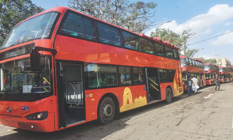 Double-decker buses parked on a road for the inaugural event.
—Fahim Siddiqi / White Star Double-decker buses parked on a road for the inaugural event.
—Fahim Siddiqi / White Star