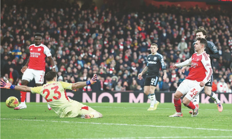 LONDON: Arsenal’s Martin Zubimendi (R) scores past Aston Villa goalkeeper Emiliano Martinez during their Premier League match at the Emirates Stadium.—Reuters LONDON: Arsenal’s Martin Zubimendi (R) scores past Aston Villa goalkeeper Emiliano Martinez during their Premier League match at the Emirates Stadium.—Reuters