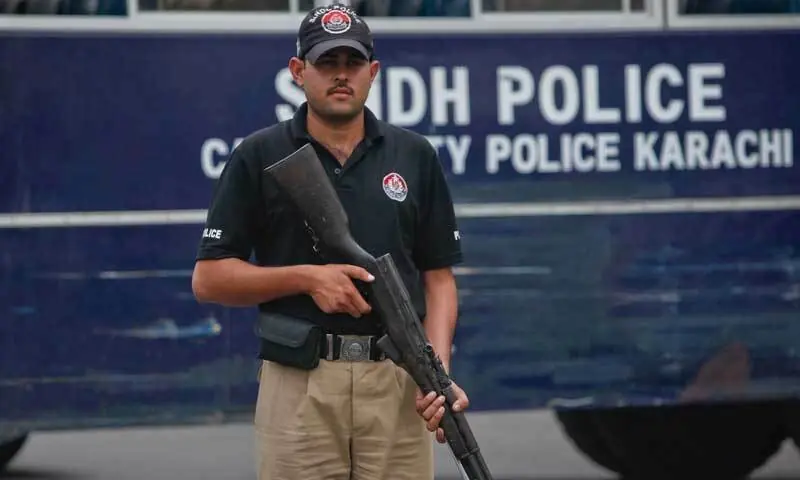 A policeman stands alert in Karachi in this file photo. &mdash; Reuters/File
