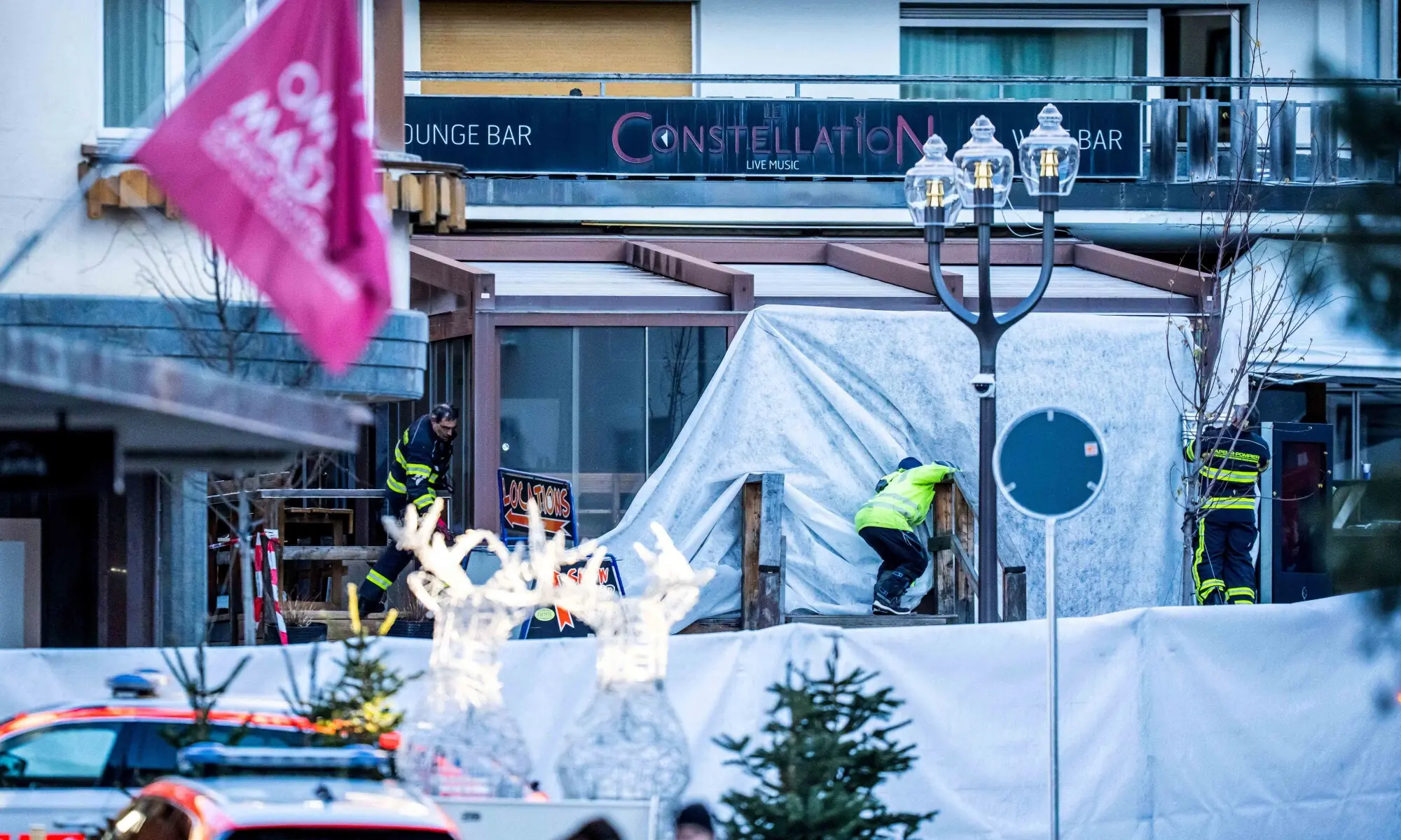 Rescuers and fire-fighters work at the site of an explosion that ripped through a bar in Crans-Montana on January 1, 2026. — AFP