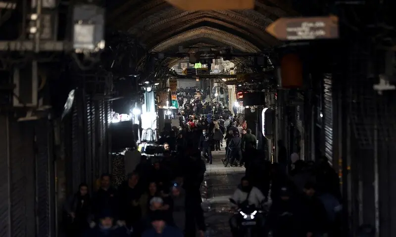 People walk past closed shops, following protests over a plunge in the currency&rsquo;s value, in the Tehran Grand Bazaar in Tehran, Iran on December 30, 2025. &mdash;Reuters