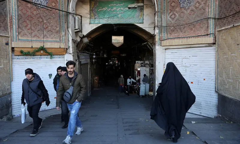 People walk past closed shops following protests over a plunge in the currency&rsquo;s value, in the Tehran Grand Bazaar in Tehran, Iran on December 30, 2025. &mdash; Reuters