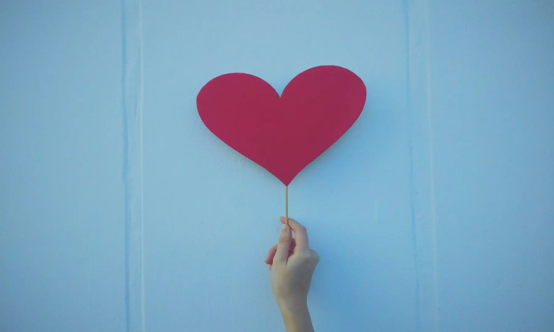 Image showing a person holding a cardboard heart. — Ryan’O Niel / Unsplash