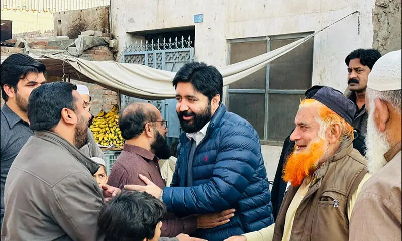 Jhang Chamber of Commerce and Industry President Sheikh Fawad Akram (C) greets people in Jhang in this photo posted on January 2. — Facebook/Sheikh Fawad Akram Jhang Chamber of Commerce and Industry President Sheikh Fawad Akram (C) greets people in Jhang in this photo posted on January 2. — Facebook/Sheikh Fawad Akram