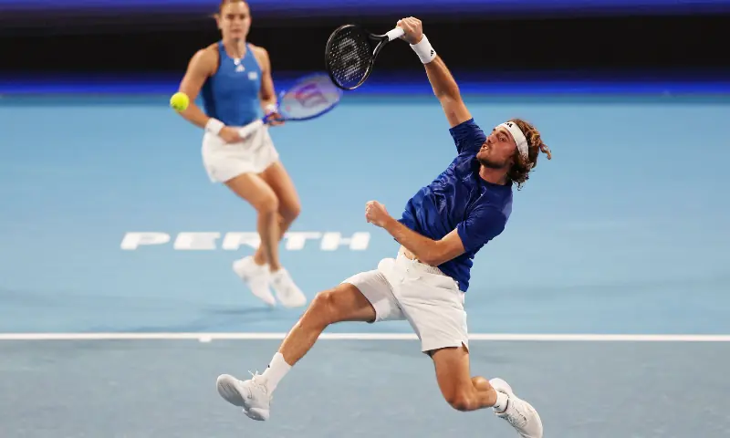 PERTH: Greece’s Stefanos Tsitsipas and Maria Sakkari play against Japan’s Yasutaka Uchiyama and Nao Hibino during their United Cup tie on Friday.—AFP PERTH: Greece’s Stefanos Tsitsipas and Maria Sakkari play against Japan’s Yasutaka Uchiyama and Nao Hibino during their United Cup tie on Friday.—AFP
