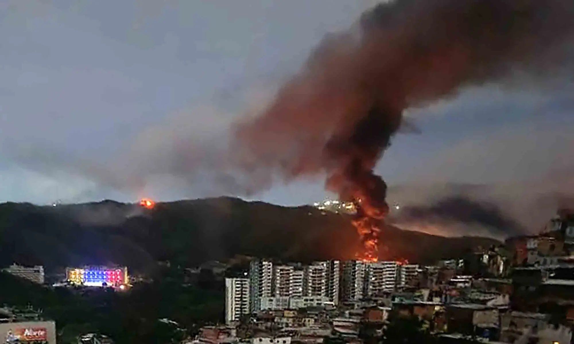 Fire at Fuerte Tiuna, Venezuela&rsquo;s largest military complex, is seen from a distance after a series of explosions in Caracas on January 3, 2026. &mdash; AFP