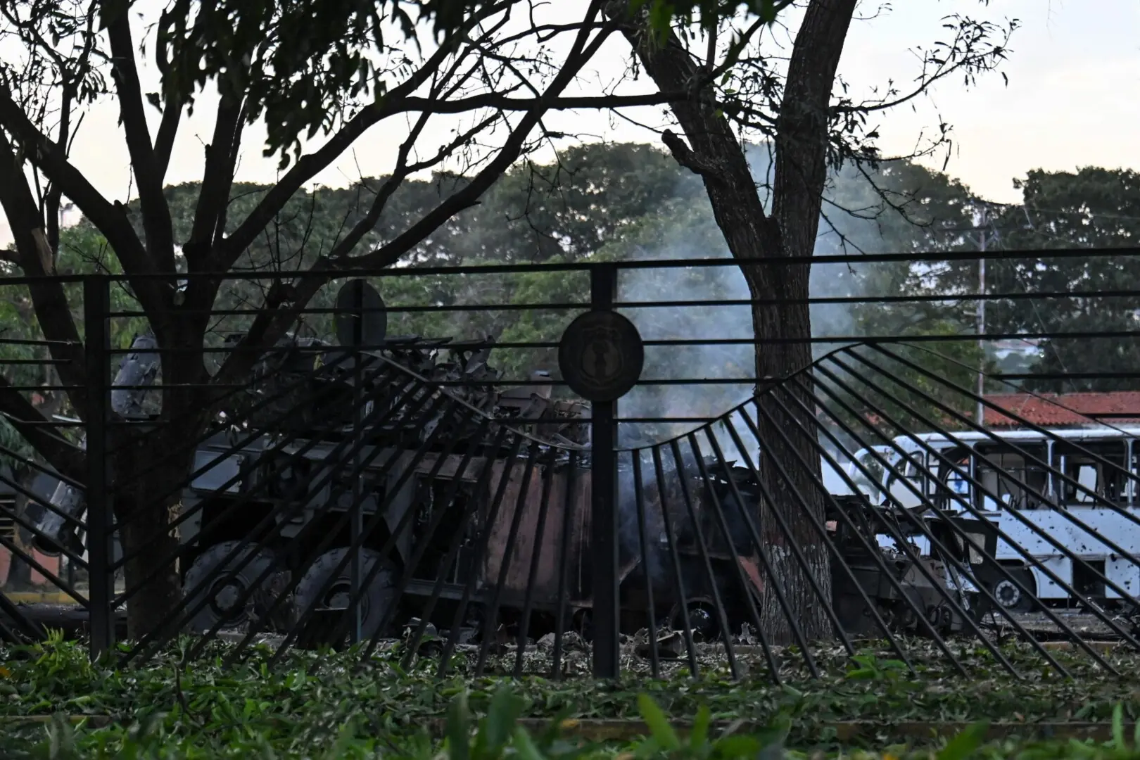 A burnt vehicle is seen at La Carlota air base in Caracas on January 3, 2026, after US forces captured Venezuelan leader Nicolas Maduro after launching a “large scale strike” on the South American country. —AFP