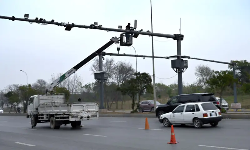 A worker is busy repairing CCTV cameras during maintenance work along Srinagar Highway in Islamabad on Jan 4, 2026. — APP A worker is busy repairing CCTV cameras during maintenance work along Srinagar Highway in Islamabad on Jan 4, 2026. — APP