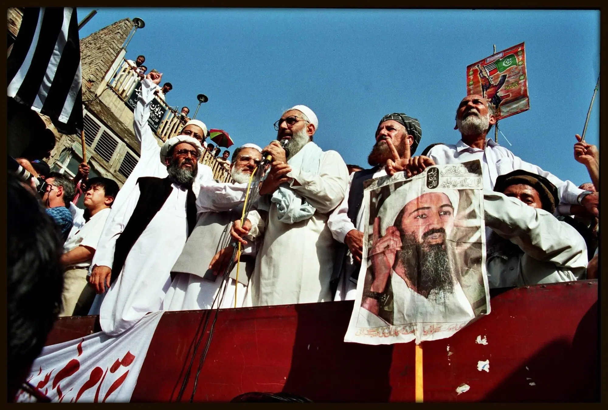 Leaders and supporters of religious political parties address a public gathering during a rally in which Osama bin Laden was publicly portrayed as a “mujahid holy warrior”.