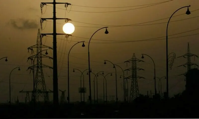 A file photo of streetlamps and energy pylons. &mdash; Reuters/File