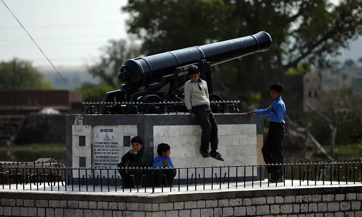 School children play beside a cannon placed in the village Dulmial in Chakwal district. A cannon was awarded to Dulmial in recognition of services rendered by all ranks from this village during and prior to first great war 1914-1919. The cannon was brought from Jhelum and placed here under the supervision of honorary captain Muhammad and other veterans in 1925.— AFP/File School children play beside a cannon placed in the village Dulmial in Chakwal district. A cannon was awarded to Dulmial in recognition of services rendered by all ranks from this village during and prior to first great war 1914-1919. The cannon was brought from Jhelum and placed here under the supervision of honorary captain Muhammad and other veterans in 1925.— AFP/File