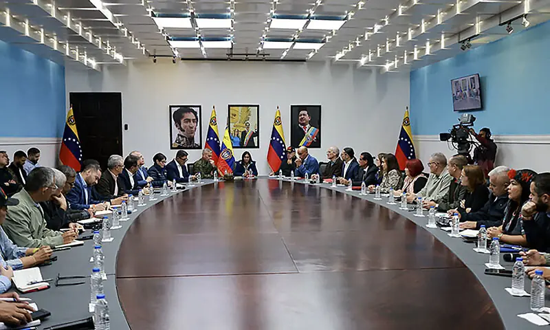 This handout picture released by the Miraflores Palace press office shows Venezuela&rsquo;s Vice-President Delcy Rodriguez (C) speaking next to Venezuelan Defence Minister Vladimir Padrino Lopez (C-L) and Venezuela&rsquo;s Minister of Interior Relations, Justice, and Peace, Diosdado Cabello (C-R) during a council of ministers meeting at the Vice Presidency headquarters in Caracas, Venezuela on January 4. &mdash; AFP