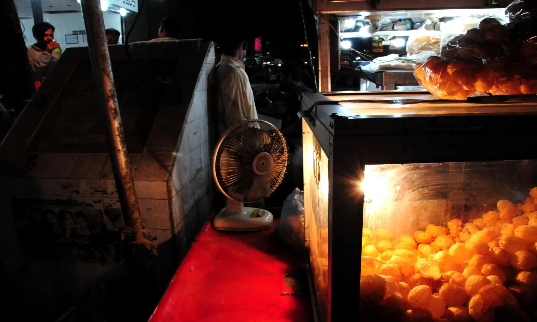 Crisp gol gappay filled with tangy water and spicy fillings at Burns Road, a beloved snack that keeps Karachiites coming back for daytime as well as late-night street food cravings. &mdash; Stephan Andrew/White Star