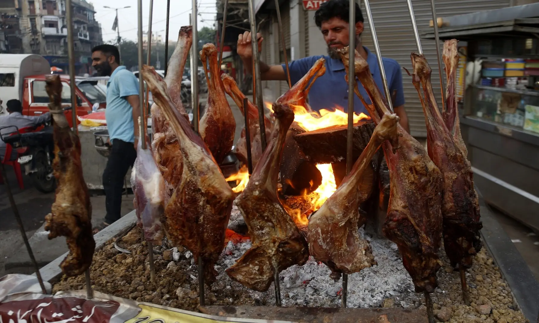 A vendor prepares a mutton sajji at Burns Road Food Street, a rich and succulent dish grilled with spices that has become a favourite for Karachiites seeking hearty, flavoursome food. &mdash; Shakil Adil/White Star