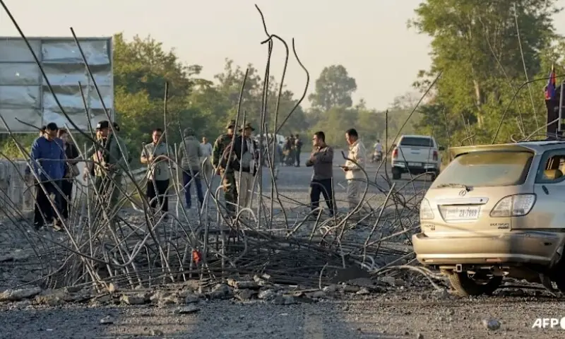 People look at a damaged bridge after Thailand carried out air strikes in an area between Cambodia&rsquo;s Oddar Meanchey and Siem Reap provinces on Dec 20, 2025. &mdash; AFP/File
